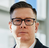 CEO of a crypto trading company, Alexander Hughes, executive portrait